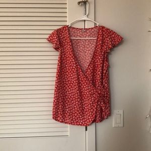red and white floral blouse